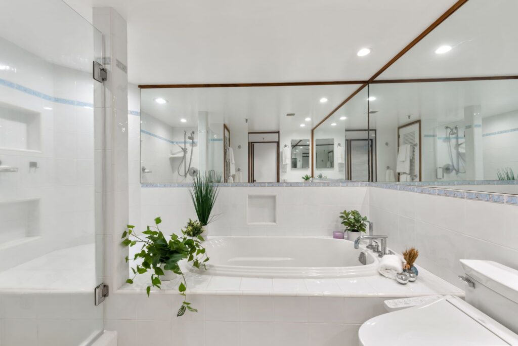 Primary bathroom with soaking tub, walk-in shower, and upgraded finishes at Punahou Cliffs #905