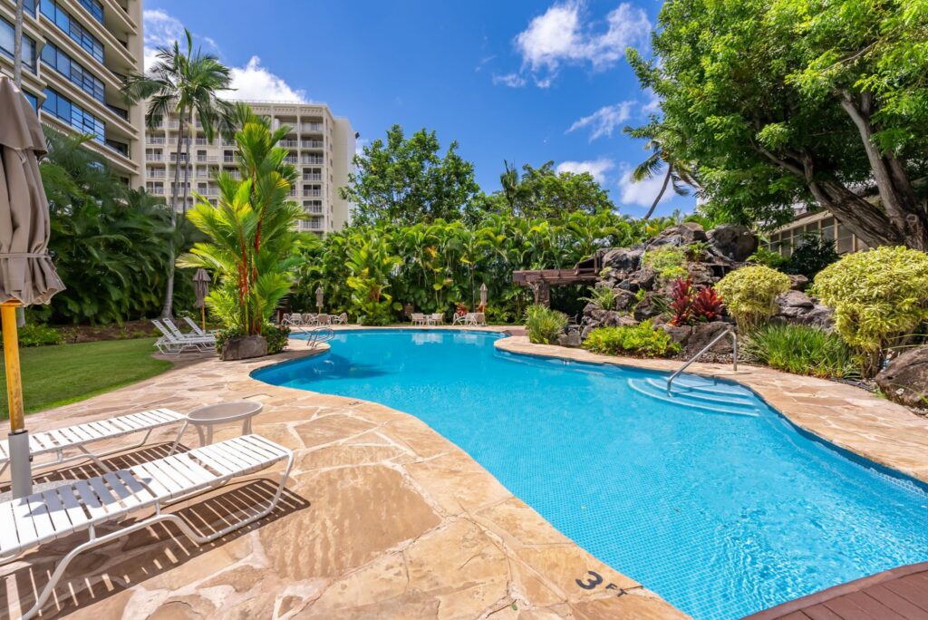 Lagoon-style swimming pool surrounded by tropical landscaping at Punahou Cliffs.