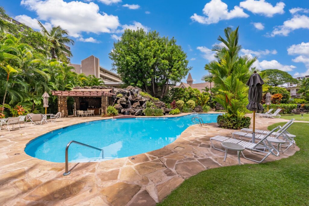 Resort-inspired pool and recreation area with lush garden setting at Punahou Cliffs.