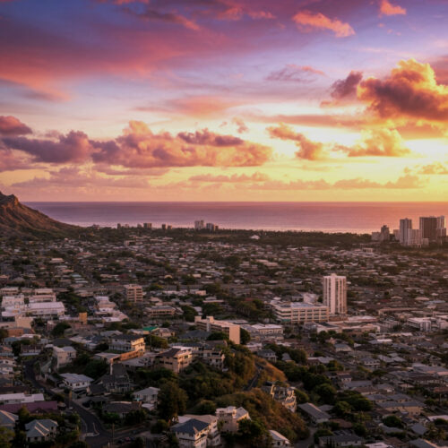 sunset in Honolulu with views of Diamond Head and the city