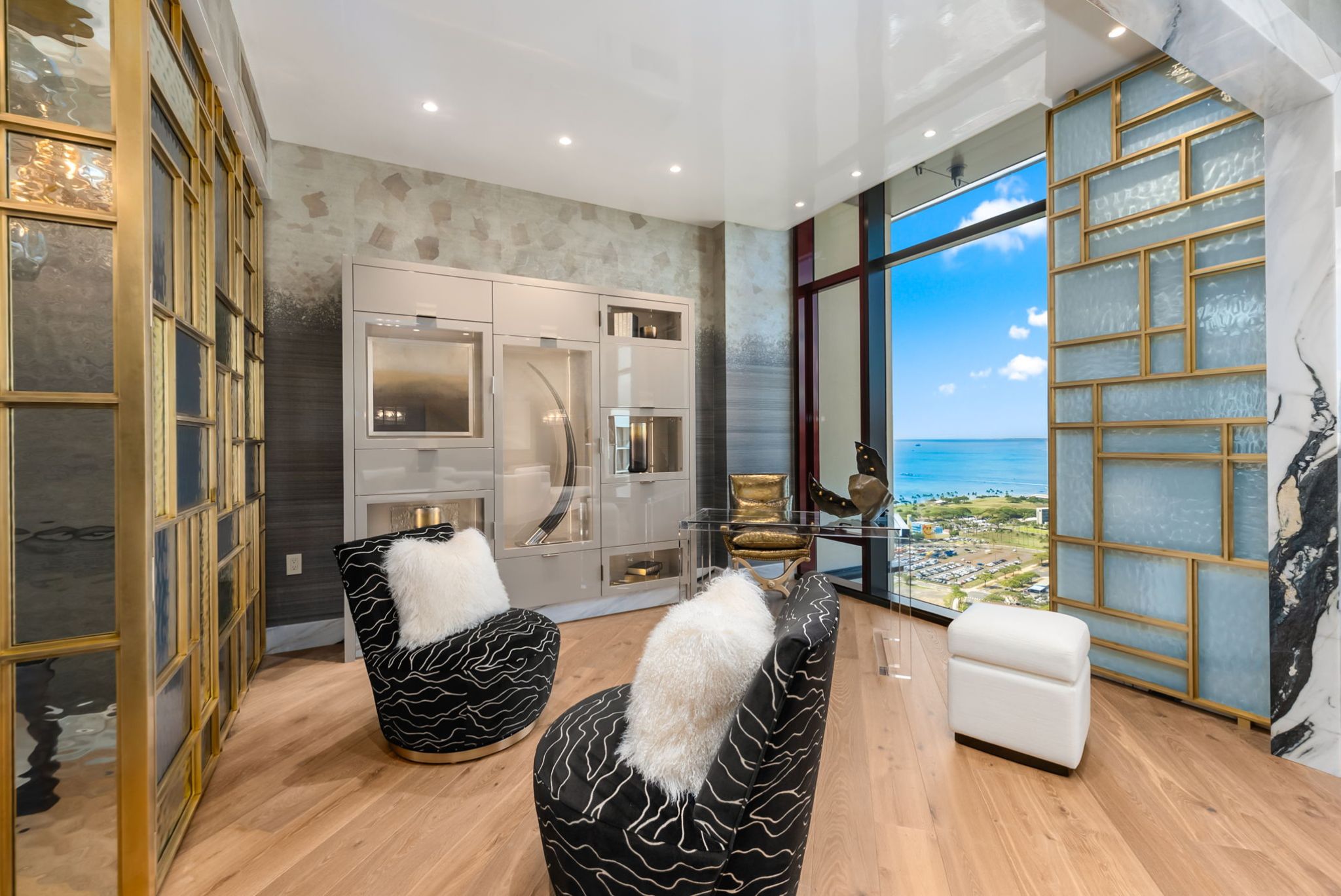 Flexible sitting area in Victoria Place Grand Penthouse 4003 with custom brass glasswork and ocean views