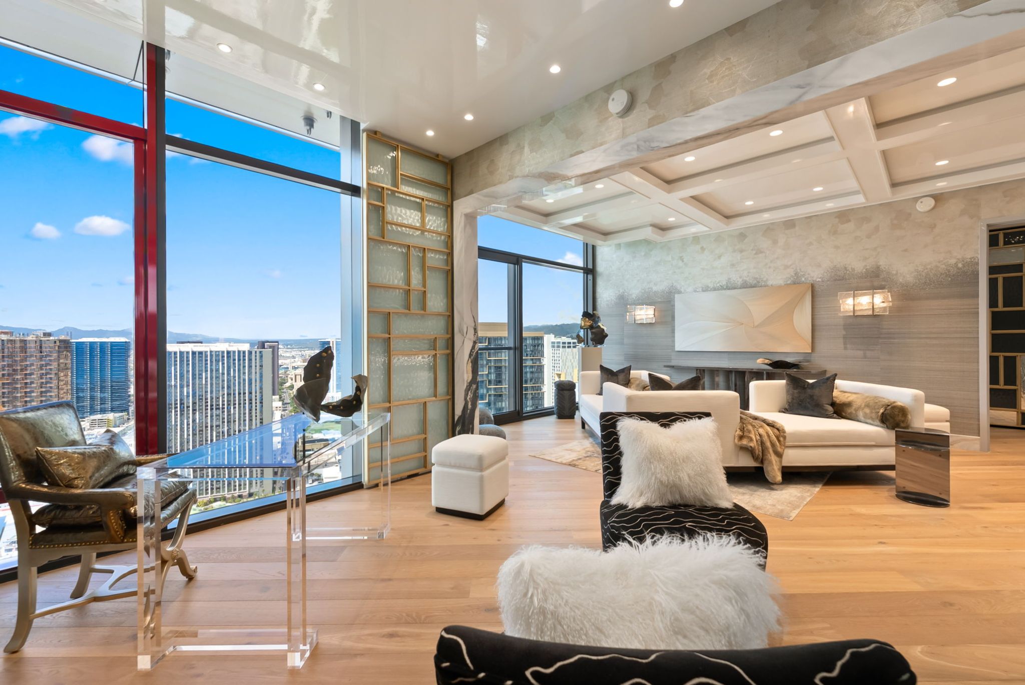Open living spaces in Penthouse 4003 with city and ocean views from floor-to-ceiling windows