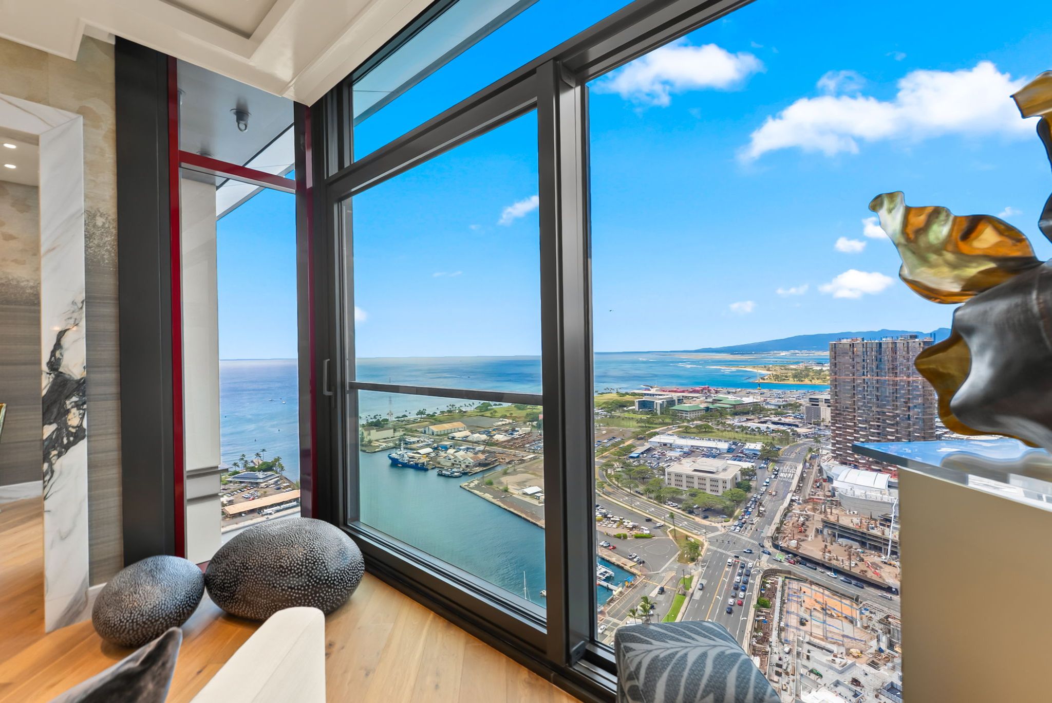 Ocean, marina and Honolulu coastline views from Victoria Place Grand Penthouse 4003 in Ward Village