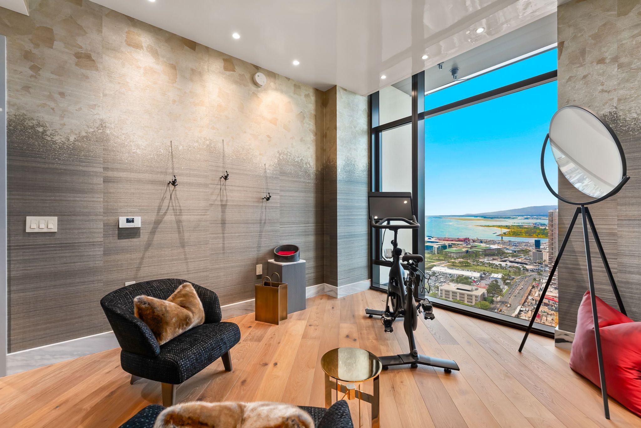 Bedroom or flex space with floor-to-ceiling windows overlooking the ocean and Ward Village