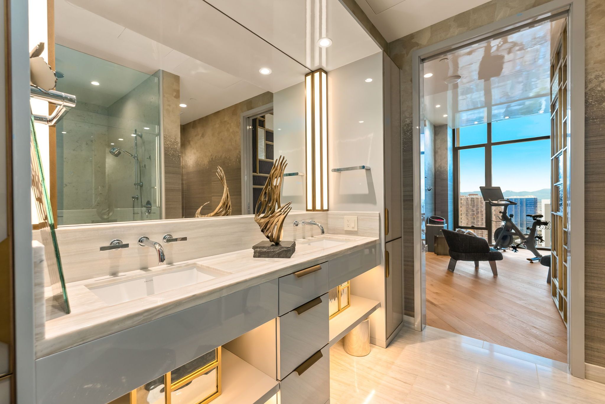 Custom bathroom vanity in Grand Penthouse 4003 with illuminated mirror and bespoke cabinetry