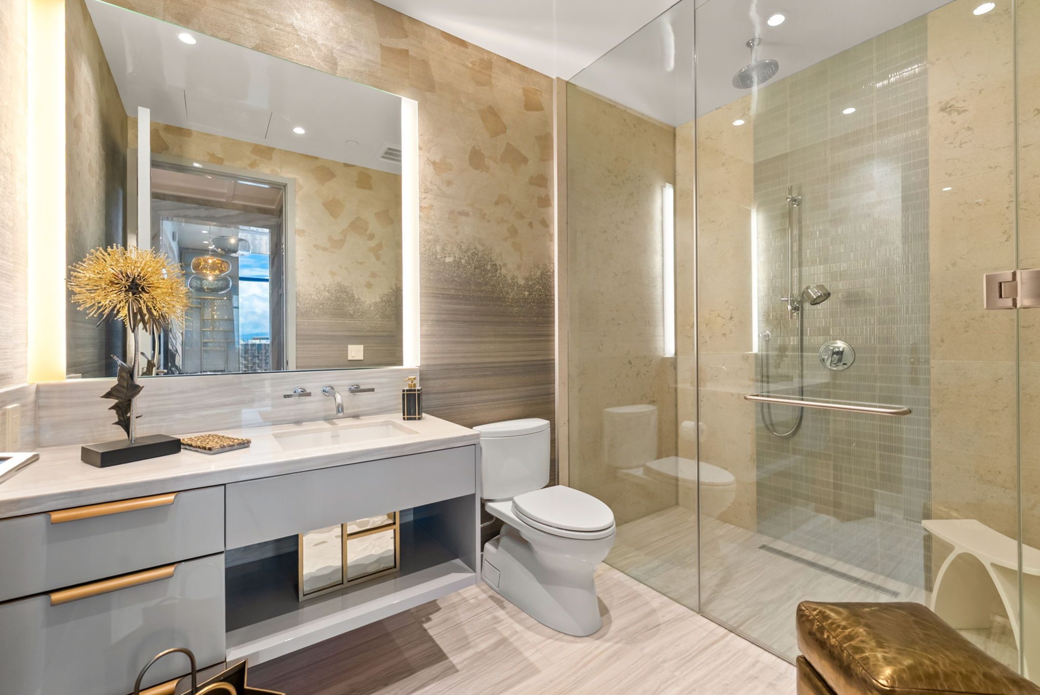 Grand Penthouse 4003 bathroom featuring glass shower, custom vanity and sophisticated stone finishes