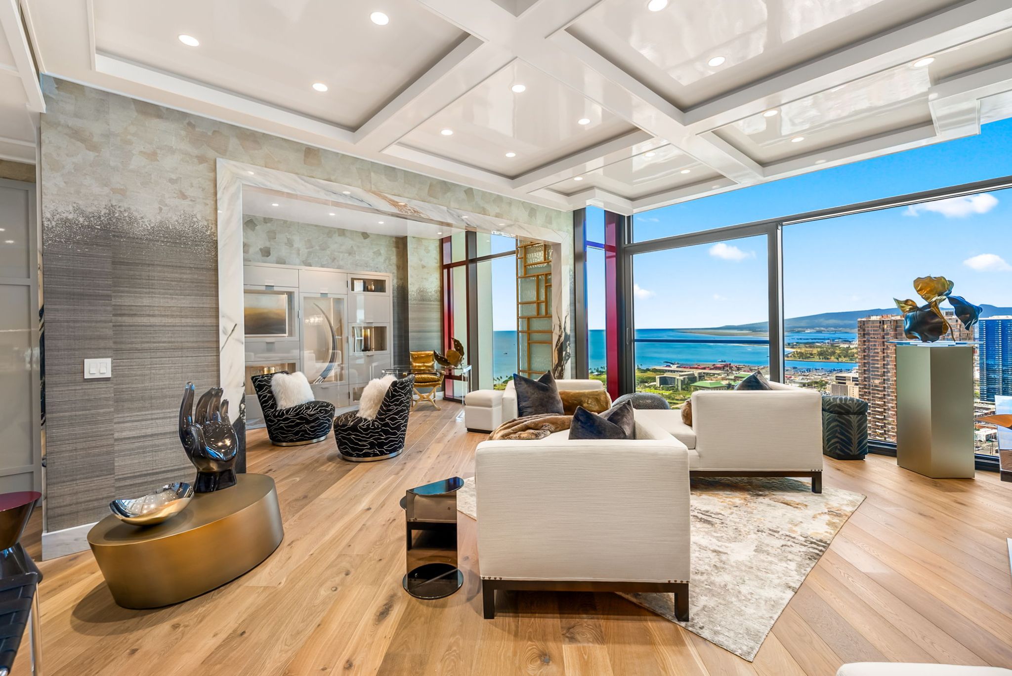 Expansive living room at Victoria Place Grand Penthouse 4003 with custom ceilings and panoramic ocean views