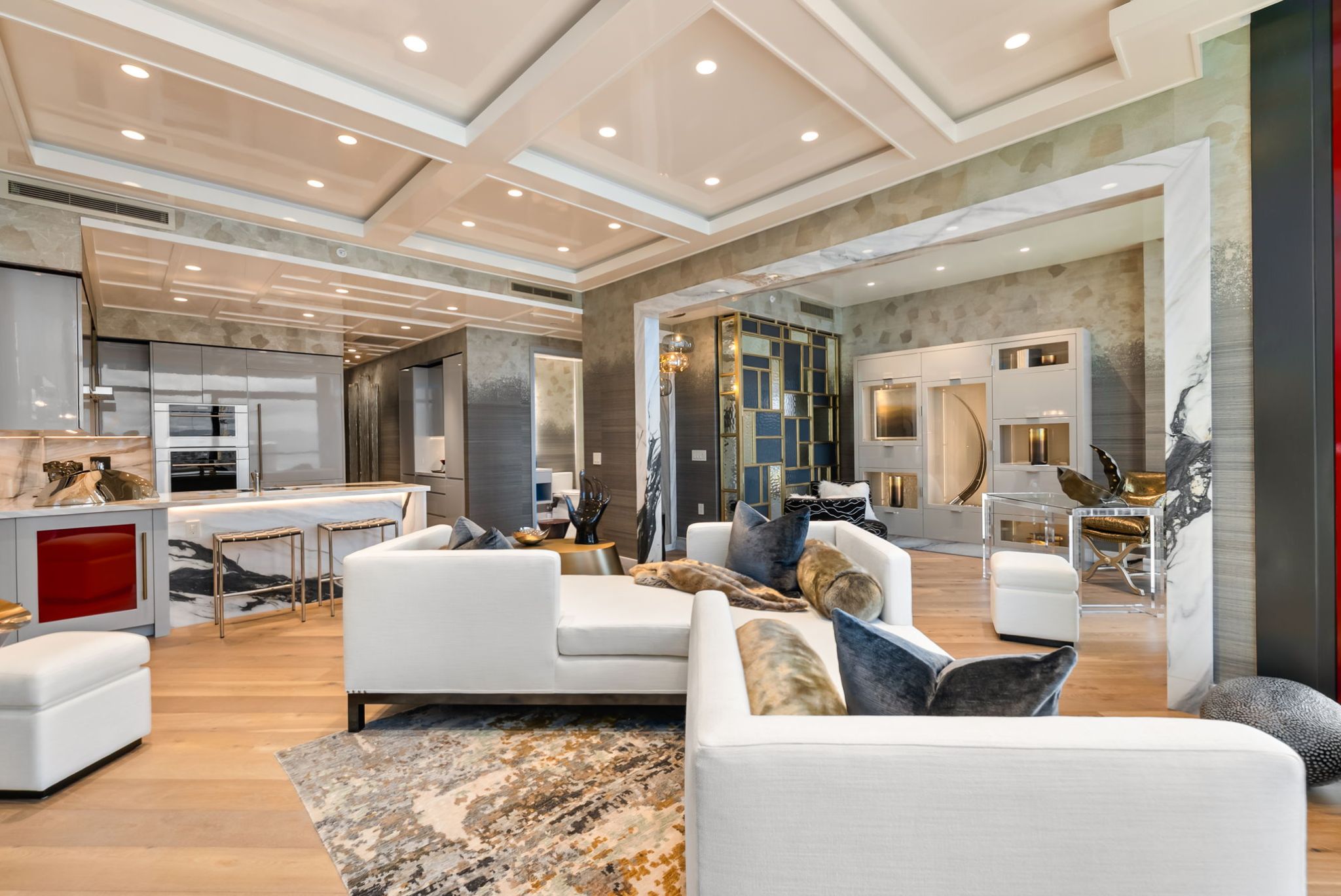 Custom living room and kitchen at Grand Penthouse 4003 featuring elevated ceilings and luxury finishes