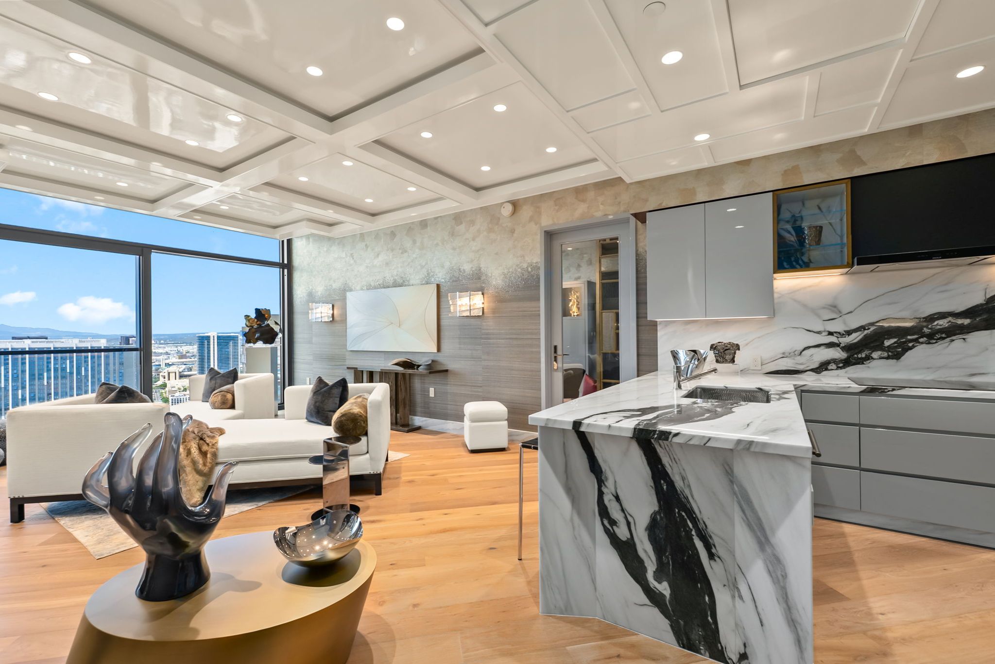 Grand Penthouse 4003 kitchen with dramatic Italian marble island and custom cabinetry