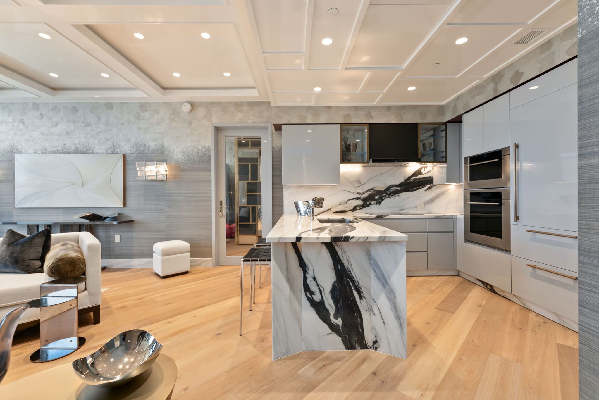 Luxury kitchen in Grand Penthouse 4003 at Victoria Place with Covelano marble and custom lacquer cabinetry